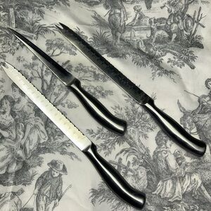 Three Serrated Kitchen Knives with Black Handles
